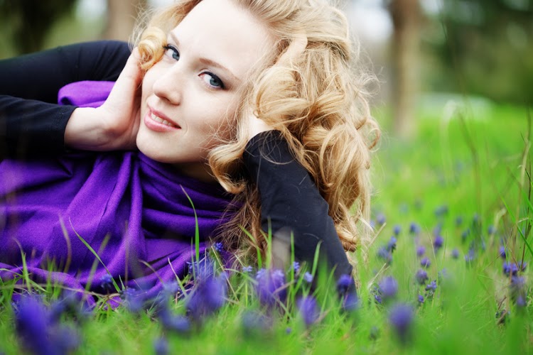 Young cute girl resting in fresh grass