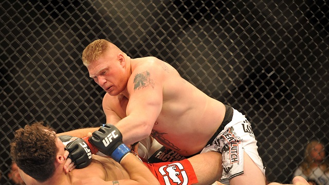LAS VEGAS - JULY 11: Brock Lesnar holds down Frank Mir during their heavyweight title bout during UFC 100 on July 11, 2009 in Las Vegas, Nevada. Lesnar defeated Mir by a second round knockout. (Photo by Jon Kopaloff/Getty Images)